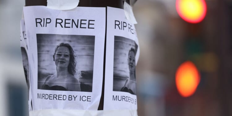 A picture is displayed at a makeshift memorial for Renee Nicole Good, who was shot and killed at point blank range on Jan. 7, 2026, by a U.S. Immigration and Customs Enforcement agent as she apparently tried to drive her car toward agents in in Minneapolis, Minnesota.