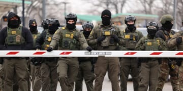 U.S. Border Patrol agents stand guard at the Bishop Henry Whipple Federal Building in Minneapolis, Minnesota, on Jan. 8, 2026.