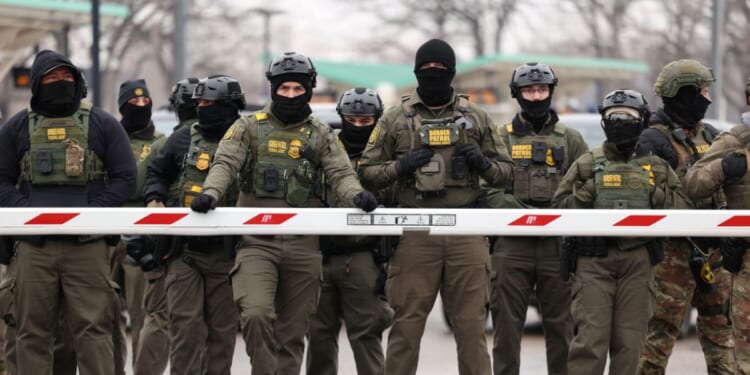 U.S. Border Patrol agents stand guard at the Bishop Henry Whipple Federal Building in Minneapolis, Minnesota, on Jan. 8, 2026.