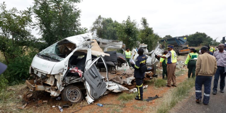 Police inspect the scene of a collision between a truck and a minibus carrying school children in Vanderbijlpark, South of Johannesburg, South Africa, on Jan. 19, 2026.