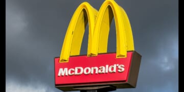 The sign for a McDonald's restaurant stands in front of a cloudy sky on Oct. 25, 2025.