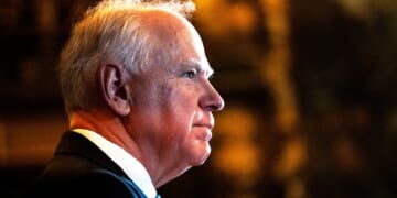 Minnesota Gov. Tim Walz is seen at a Jan. 5 news conference in St. Paul, Minnesota, where he announced that he was abandoning his re-election campaign. Now, Republicans in the state legislature are planning to impeach him.