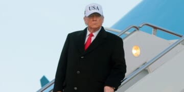 President Donald Trump walks down the air stairs after landing on Air Force One on Jan. 13, 2026, at Joint Base Andrews, Maryland.