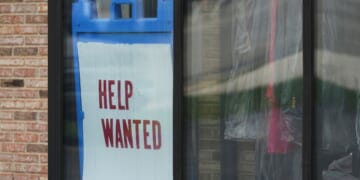 "Help Wanted" sign is displayed at a dry cleaner in Rolling Meadows, Illinois, on May 15, 2025.