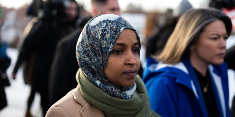 Rep. Ilhan Omar and Rep. Angie Craig arrive outside of the regional ICE headquarters at the Bishop Henry Whipple Federal Building on Jan. 10, 2026, in Minneapolis, Minnesota.