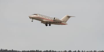 A Bombardier CL-600-2B16 Challenger is taking off from a runway on Feb. 24, 2022, in Zurich, Switzerland.