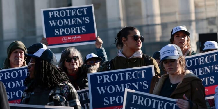Protesters against transgender athletes competing in women's sports gather outside the Supreme Court on Jan. 13, 2026, in Washington, D.C.