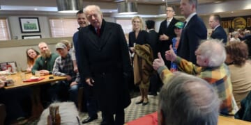 President Donald Trump greets patrons as he visits the Machine Shed restaurant on Jan. 27, 2026, in Urbandale, Iowa.