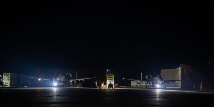 In this handout photo in an undisclosed location, U.S. A-10 Thunderbolt IIs prepare to taxi in support of Operation Hawkeye Strike at a base in the U.S. Central Command area of responsibility on Dec. 19, 2025.