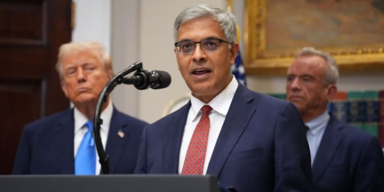 Director of the National Institutes of Health Jay Bhattacharya, joined by President Donald Trump and Health and Human Services Secretary Robert F. Kennedy Jr., delivers remarks during an announcement by President Donald Trump on “significant medical and scientific findings for America’s children” in the Roosevelt Room of the White House on Sept. 22, 2025, in Washington, D.C.