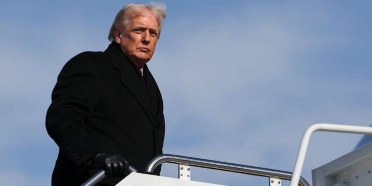 President Donald Trump boards Air Force One at Joint Base Andrews, Maryland, on Jan. 27, 2026.