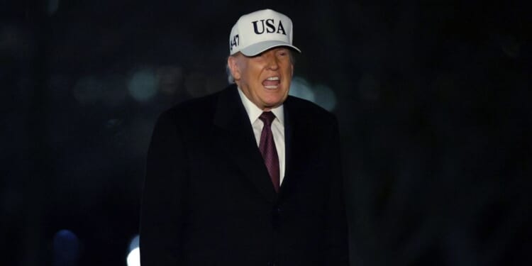 President Donald Trump walks on the South Lawn after he landed at the White House on Jan. 11, 2026, in Washington, D.C.