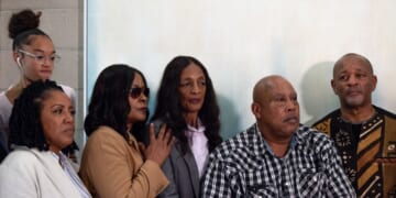 Family and friends of Keith Porter Jr. pose for a photo after a news conference on Jan. 5, 2026, in Studio City, California.