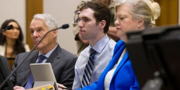 Tyler Robinson, center, accused in the fatal shooting of Charlie Kirk, appears during a hearing in 4th District Court on Jan. 16 in Provo, Utah. Prosecutors have charged Robinson with aggravated murder and plan to seek the death penalty.