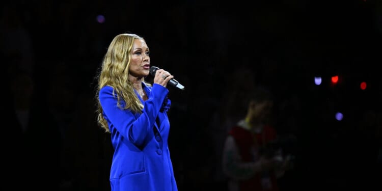 American singer Vanessa Williams sings the U.S. national anthem before the 2025-2026 NBA season basketball match between the Memphis Grizzlies and Orlando Magic at the O2 Arena in London on Jan. 18, 2026.