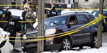 Members of law enforcement work the scene following a suspected shooting by an ICE agent during federal law enforcement operations on Jan. 7, 2026, in Minneapolis, Minnesota.