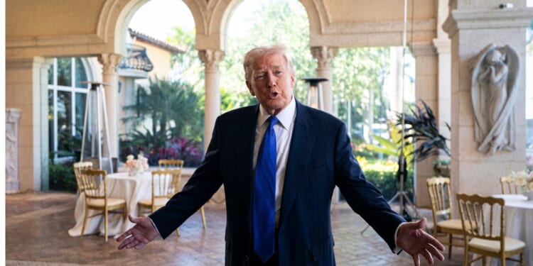 President Donald Trump speaks to the media at Mar-a-Lago Sunday in Palm Beach, Florida.