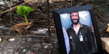 A photograph of 37-year-old Alex Pretti can be seen at a makeshift memorial in the area where he was shot dead by federal immigration agents earlier in the day in Minneapolis, Minnesota, on Jan. 24, 2026.