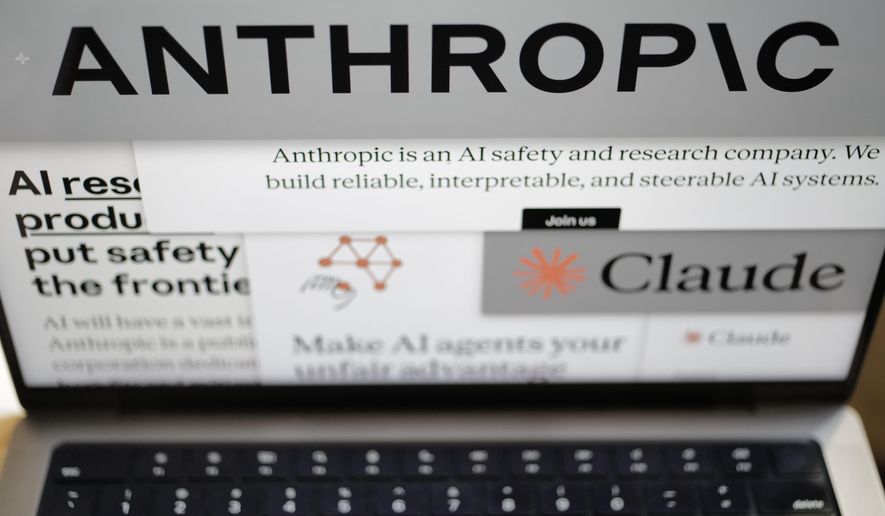 Pages from the Anthropic website and the company's logos are displayed on a computer screen in New York on Thursday, Feb. 26, 2026. (AP Photo/Patrick Sison)