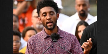 Baltimore Mayor Brandon Scott, left, speaks during a Sept. 5 news conference.