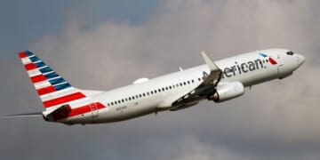 An American Airlines Boeing 737-800 takes off from Miami International Airport in a file photo dated Dec. 10, 2021. An American Airlines crew found a bullet hole in a similar plane after it landed in Colombia this week.