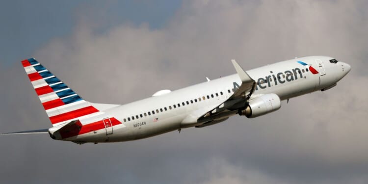 An American Airlines Boeing 737-800 takes off from Miami International Airport in a file photo dated Dec. 10, 2021. An American Airlines crew found a bullet hole in a similar plane after it landed in Colombia this week.