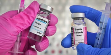 Vials of testosterone and estrogen for injection treatment.