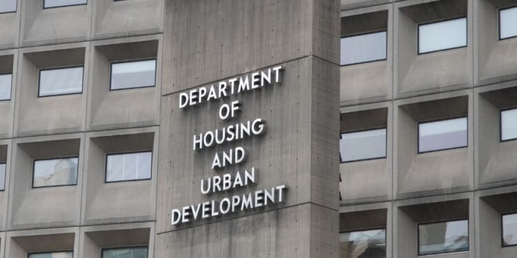 A view of the U.S. Department of Housing and Urban Development from the outside with the department's name displayed on the side of the building.