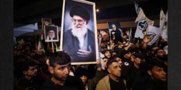 Iraqi Shiites carry a portrait of Iran's Supreme Leader Ayatollah Ali Khamenei during a protest Saturday against U.S. and Israeli attacks on Iran. News sources were reporting that Khameni has be