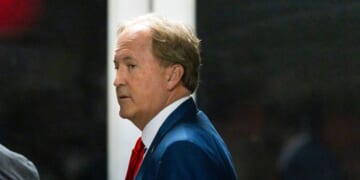 Texas Attorney General Ken Paxton arrives with President Donald Trump to court during Trump's trial for allegedly covering up hush money payments at Manhattan Criminal Court on April 30, 2024, in New York City.