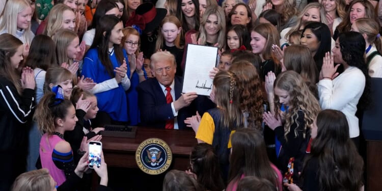President Donald Trump was joined by women athletes as he signed the “No Men in Women’s Sports” executive order in the East Room at the White House on Feb. 5, 2025.