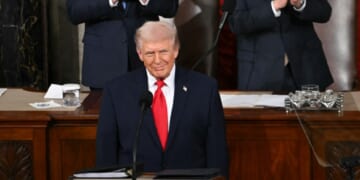 President Donald Trump gives a wry grin as he begins his State of the Union address Tuesday in the Capitol.