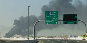 A plume of smoke rises from the port of Jebel Ali Sunday following an Iranian strike in Dubai, United Arab Emirates. News outlets reported Tuesday that a new strike targeted the U.S. consulate compound in the city.