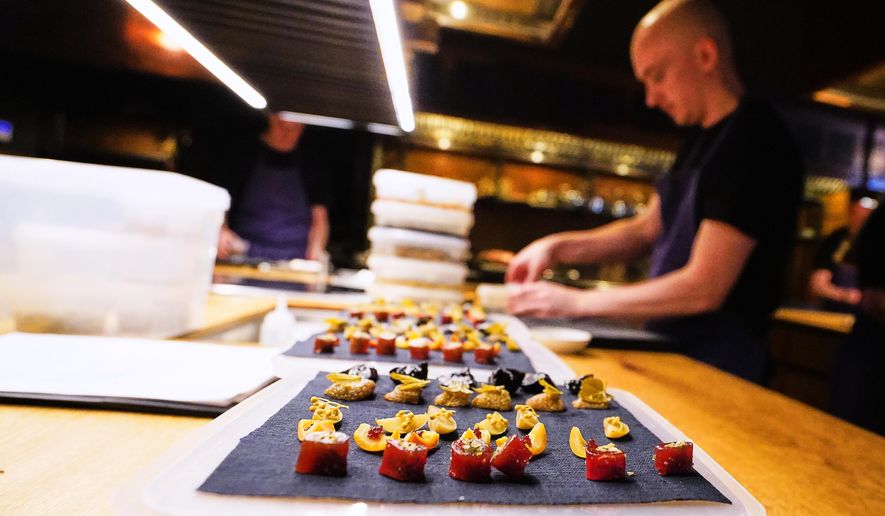 Chiefs prepare food at the restaurant Kadeau in Copenhagen, Denmark, Feb. 12, 2026. (AP Photo/James Brooks)