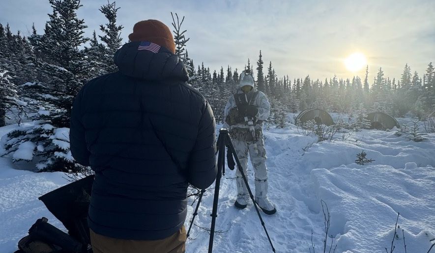 John T. Seward interviews the detachment commander for Operational Detachment Alpha-0314, as his team conducts Arctic warfare training at Donnelly Training Area West of Fort Greeley, Alaska. His face has been removed for security as his team is the premier military free fall parachute unit out of Fort Carson, Colorado.(Photo by John T. Seward/The Washington Times)