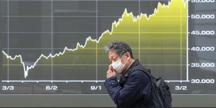 World shares decline, while oil pops above $100 a barrel over Iran war worries