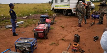 South African soldiers dismantle illegal mining operations near Johannesburg as miners flee