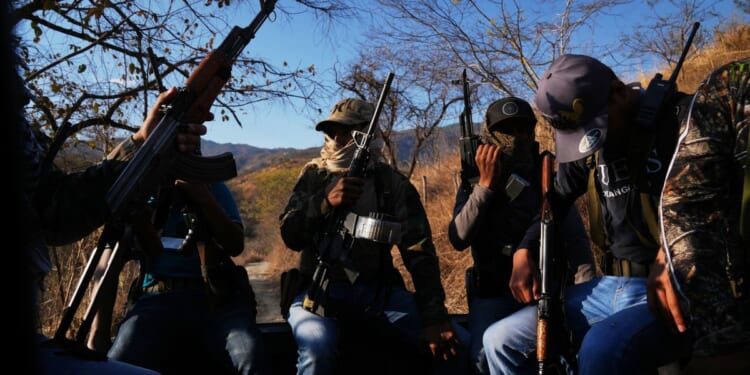 Civilians under siege by a Mexican cartel are now fighting back with AK-47s and grenades