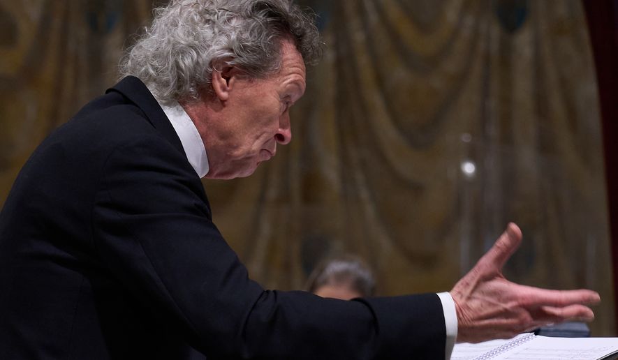 Harry Christopher conducts Angels Unawares byJames MacMillan in the Sistine Chapel at the Vatican, Sunday, March 22, 2026. (AP Photo/Domenico Stinellis)