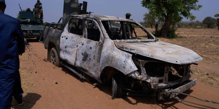 Militants in northern Nigeria kill 10 security forces and 1 resident, officials say
