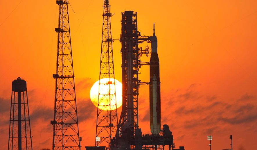 NASA's Space Launch System rocket with the Orion spacecraft set for the Artemis 2 mission is seen on Launch Complex 39B at sunrise at the Kennedy Space Center, Tuesday, March 24, 2026, in Cape Canaveral, Fla. (AP Photo/John Raoux)