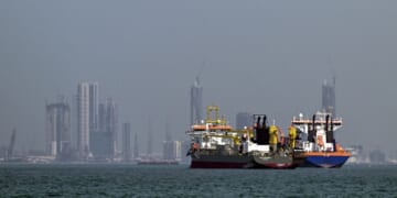 Commercial vessels are pictured offshore in Dubai on March 11, 2026.