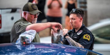 Police bag magazines of ammunition after arresting a man outside of a watch party for GOP Texas Senate Candidate Ken Paxton on March 3, 2026 in Dallas, Texas. Paxton is facing off against numerous candidates including incumbent Senator John Cornyn in the Republican Senate primary.