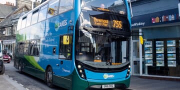 A bus drives down the street in Windermere, Cumbria, UK on March 7, 2023.