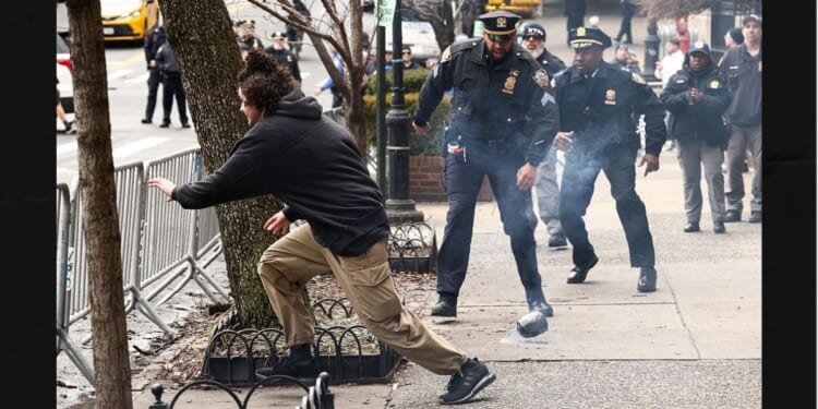 A left-wing activist flees after allegedly throwing a homemade explosive device toward police Saturday in front of Gracie Mansion, New York mayor Zohran Mamdani's official residence.