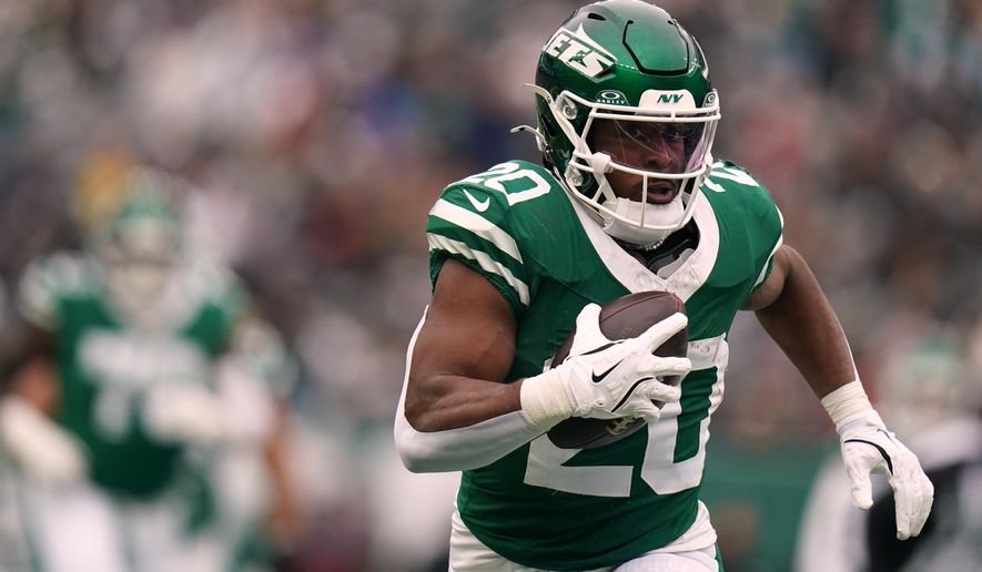 FILE - New York Jets running back Breece Hall (20) carries the ball during an NFL football game against the New England Patriots, Dec. 28, 2025, in New York. (AP Photo/Vera Nieuwenhuis, File)