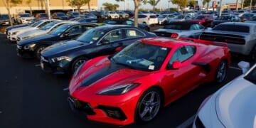 Vehicles for sale are parked in a lot at a CarMax dealership on April 24, 2025, in San Diego, California.
