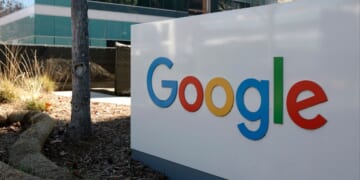A sign is posted at Google headquarters in Mountain View, California. Three Iranian immigrants have been accused of conspiring to commit trade secret theft from Google and other leading technology companies.