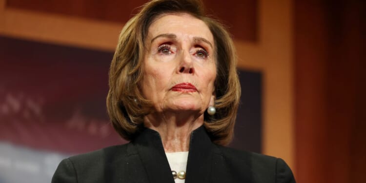 Speaker Emerita Nancy Pelosi listens to House Minority Leader Hakeem Jeffries speak at the U.S. Capitol on Nov. 20, 2025, in Washington, D.C.