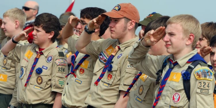 U.S. Boy Scouts are seen saluting while listening to their country's anthem in a file photo dated April 16, 2011.